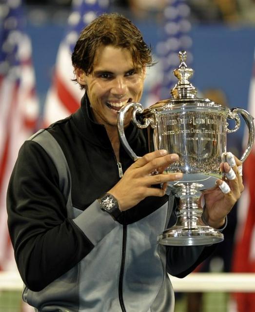 Rafael Nadal bites his 2010 US Open championship trophy